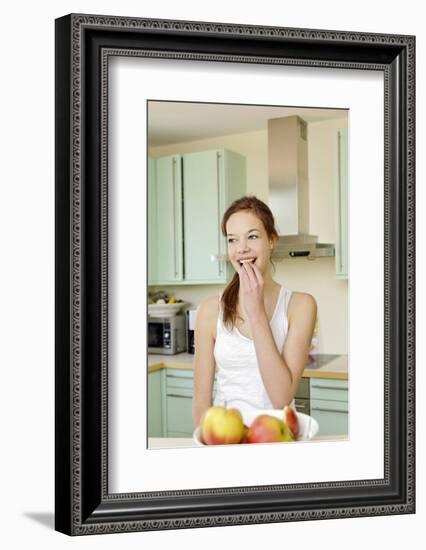 Teenage Girl Cutting Apples, Portrait, Healthy Nutrition-Axel Schmies-Framed Photographic Print