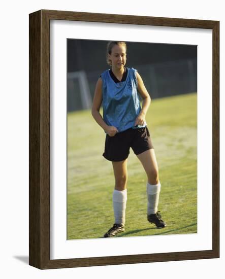 Teenage Girl on a Soccer Field-null-Framed Photographic Print