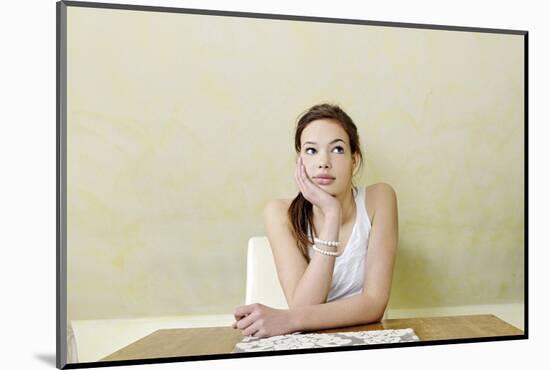 Teenage Girl Sitting at the Table, Thoughtful, Portrait-Axel Schmies-Mounted Photographic Print