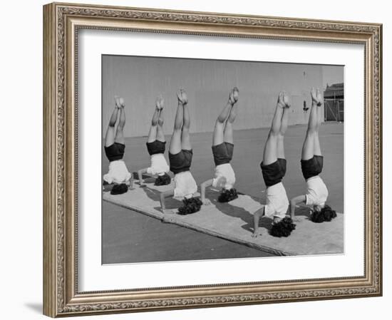 Teenage Girls from Hoover High School Standing on Their Heads in Gymnastics Class-Martha Holmes-Framed Photographic Print