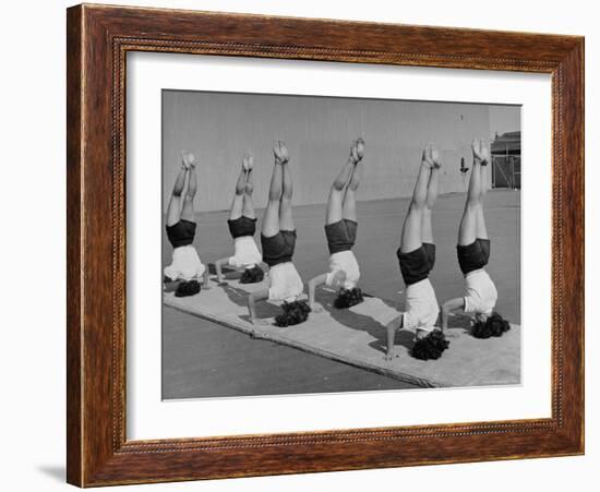 Teenage Girls from Hoover High School Standing on Their Heads in Gymnastics Class-Martha Holmes-Framed Photographic Print