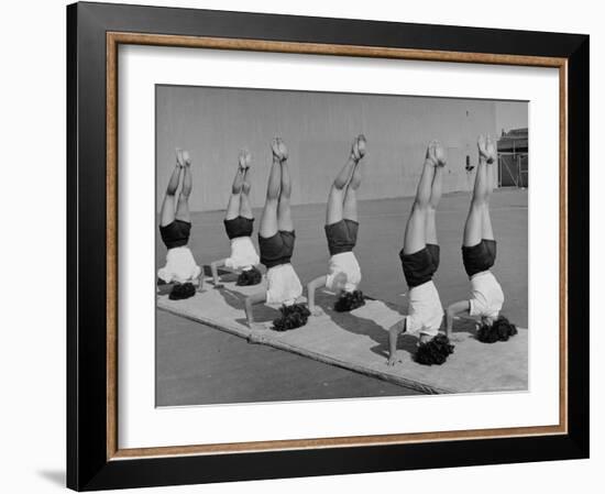 Teenage Girls from Hoover High School Standing on Their Heads in Gymnastics Class-Martha Holmes-Framed Photographic Print