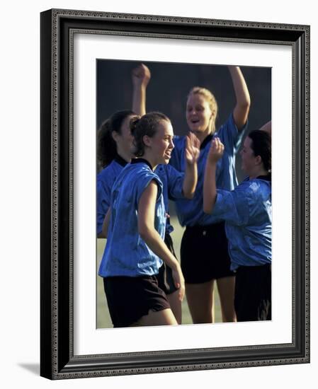 Teenage Girls on a Soccer Team Celebrating-null-Framed Photographic Print