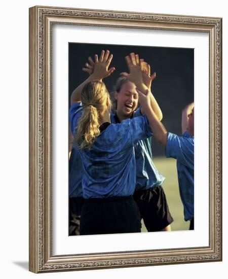 Teenage Girls on a Soccer Team Celebrating-null-Framed Photographic Print