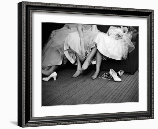 Teenage Girls Resting Feet at First Formal Dance at the Naval Armory-Cornell Capa-Framed Photographic Print