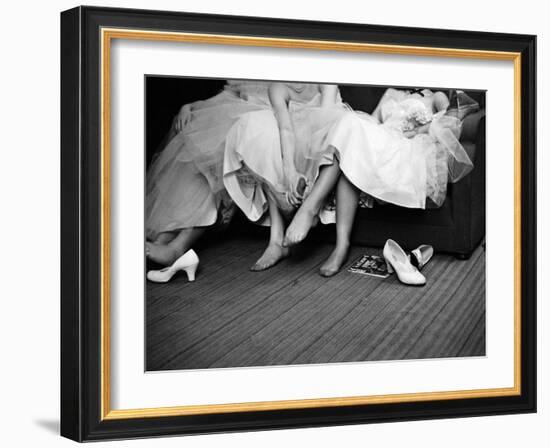 Teenage Girls Resting Feet at First Formal Dance at the Naval Armory-Cornell Capa-Framed Photographic Print