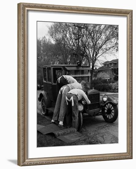 Teenaged Boys Working on a 1927 Ford Model T Automobile-Nina Leen-Framed Premium Photographic Print