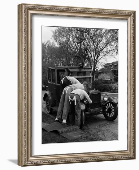 Teenaged Boys Working on a 1927 Ford Model T-Nina Leen-Framed Photographic Print