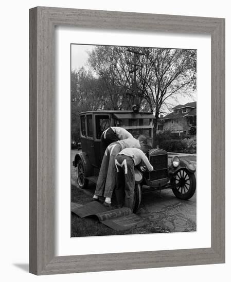 Teenaged Boys Working on a 1927 Ford Model T-Nina Leen-Framed Photographic Print