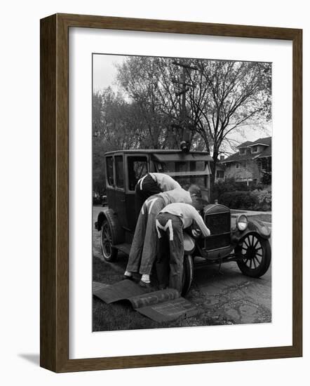 Teenaged Boys Working on a 1927 Ford Model T-Nina Leen-Framed Photographic Print