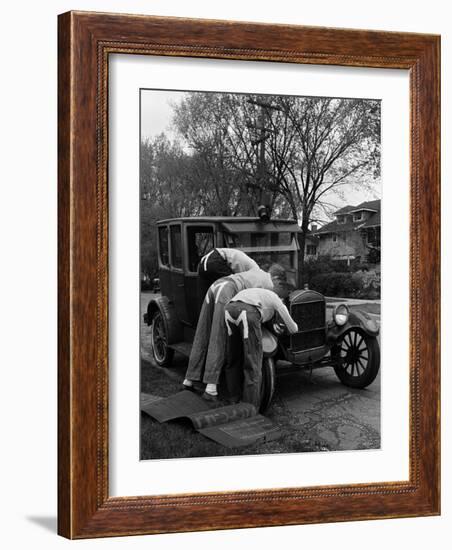 Teenaged Boys Working on a 1927 Ford Model T-Nina Leen-Framed Photographic Print