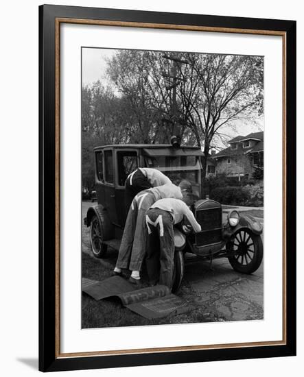 Teenaged Boys Working on a 1927 Ford Model T-Nina Leen-Framed Photographic Print