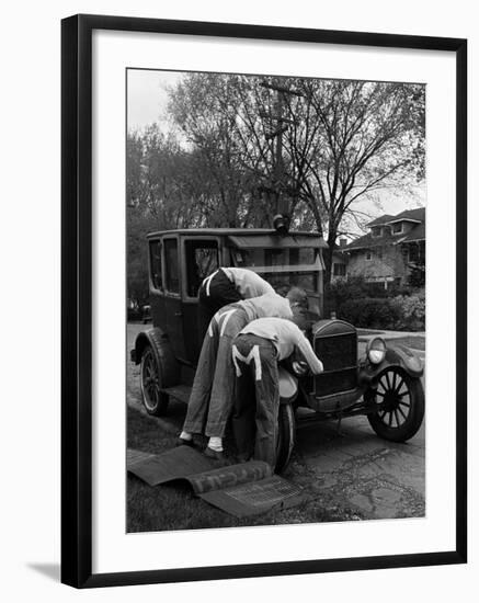 Teenaged Boys Working on a 1927 Ford Model T-Nina Leen-Framed Photographic Print