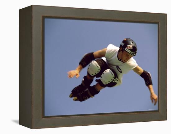 Teenager Inline Skating in Mid-Air-null-Framed Premier Image Canvas