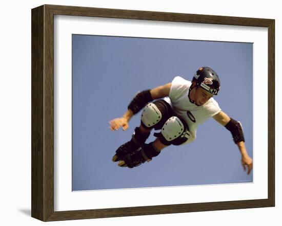 Teenager Inline Skating in Mid-Air-null-Framed Photographic Print