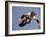 Teenager Inline Skating in Mid-Air-null-Framed Photographic Print