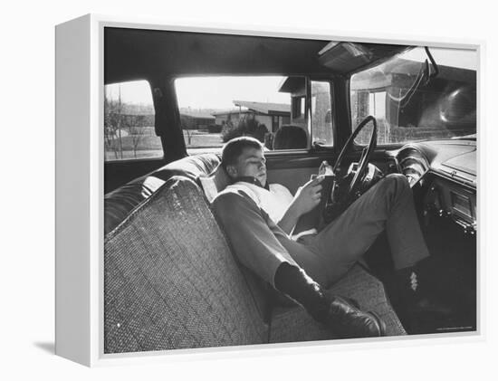 Teenager Robert Riesenmy Jr. Reading in Car at Home-Robert W^ Kelley-Framed Premier Image Canvas