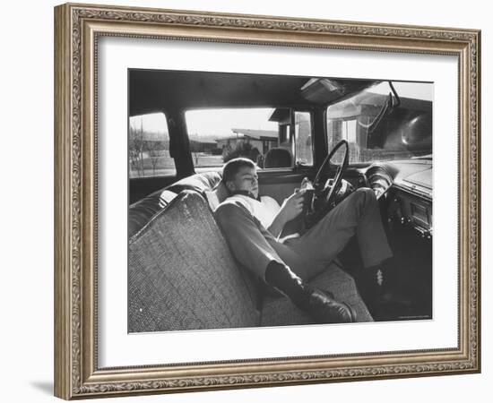 Teenager Robert Riesenmy Jr. Reading in Car at Home-Robert W^ Kelley-Framed Photographic Print