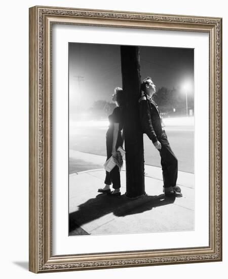 Teenagers Leaning on Utility Pole-Bettmann-Framed Photographic Print