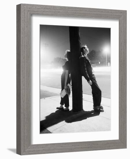 Teenagers Leaning on Utility Pole-Bettmann-Framed Photographic Print