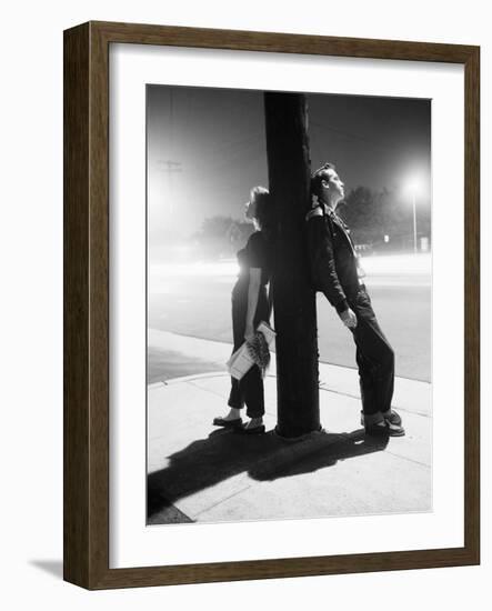 Teenagers Leaning on Utility Pole-Bettmann-Framed Photographic Print