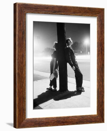 Teenagers Leaning on Utility Pole-Bettmann-Framed Photographic Print