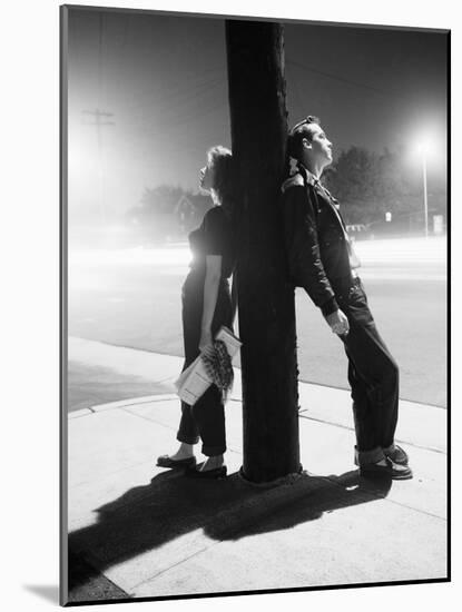 Teenagers Leaning on Utility Pole-Bettmann-Mounted Photographic Print