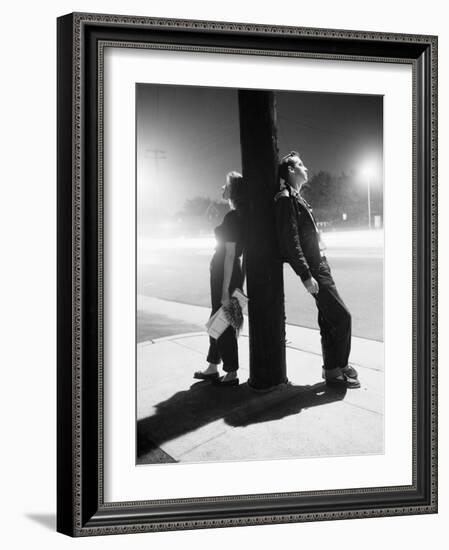 Teenagers Leaning on Utility Pole-Bettmann-Framed Photographic Print