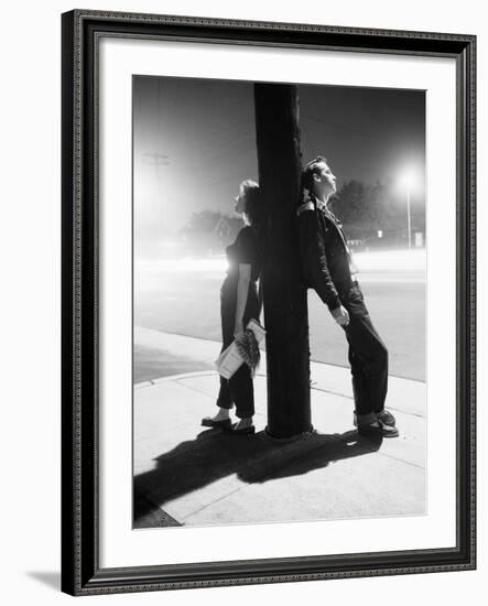 Teenagers Leaning on Utility Pole-Bettmann-Framed Photographic Print