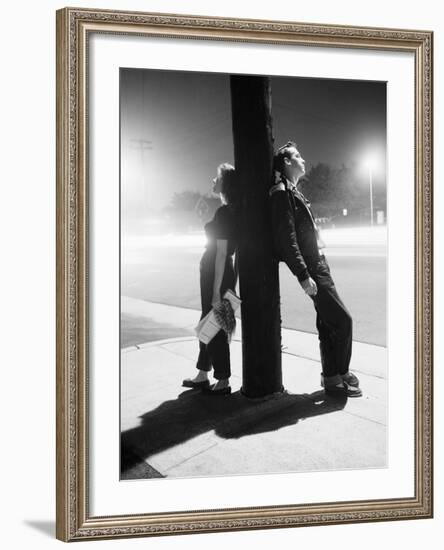 Teenagers Leaning on Utility Pole-Bettmann-Framed Photographic Print