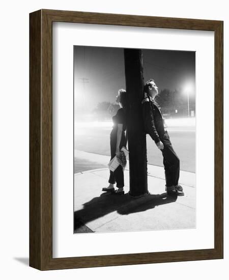 Teenagers Leaning on Utility Pole-Bettmann-Framed Photographic Print