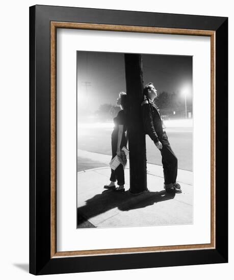 Teenagers Leaning on Utility Pole-Bettmann-Framed Photographic Print