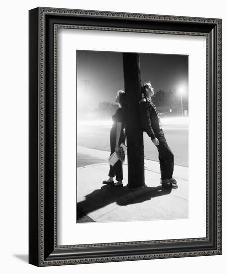 Teenagers Leaning on Utility Pole-Bettmann-Framed Photographic Print