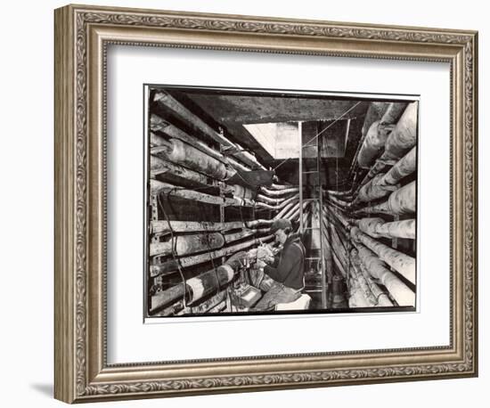 Telephone Repair Man Splicing a Wire in a Manhole for Telephone Cables of the New York Telephone Co-Margaret Bourke-White-Framed Photographic Print