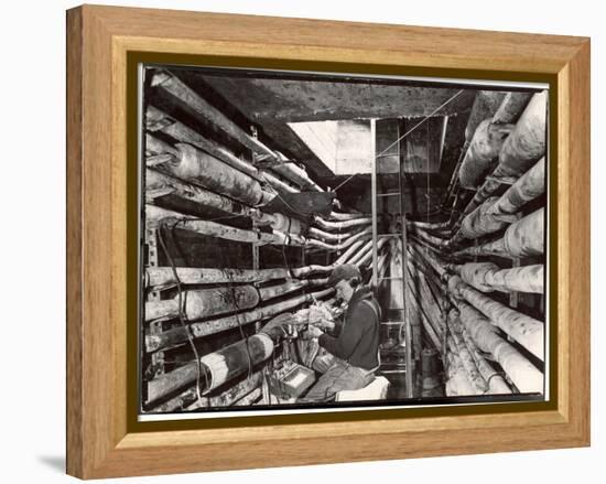 Telephone Repair Man Splicing a Wire in a Manhole for Telephone Cables of the New York Telephone Co-Margaret Bourke-White-Framed Premier Image Canvas