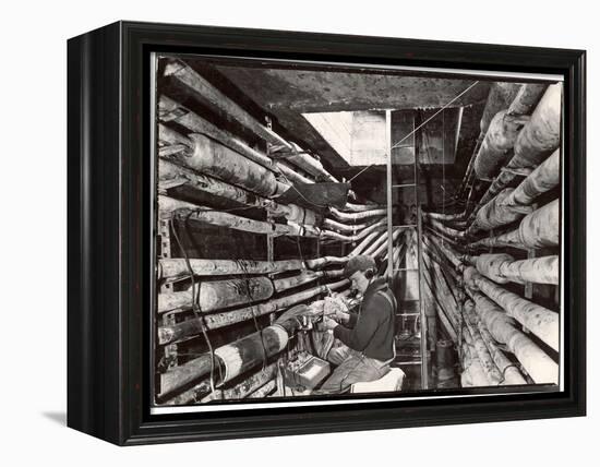 Telephone Repair Man Splicing a Wire in a Manhole for Telephone Cables of the New York Telephone Co-Margaret Bourke-White-Framed Premier Image Canvas