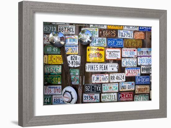 Telluride, Colorado: License Plates Hang On A Fence On A Home In An Alleyway In Downtown Telluride-Ian Shive-Framed Photographic Print