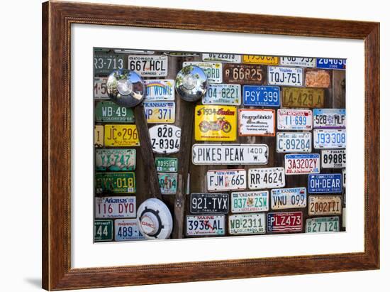 Telluride, Colorado: License Plates Hang On A Fence On A Home In An Alleyway In Downtown Telluride-Ian Shive-Framed Photographic Print