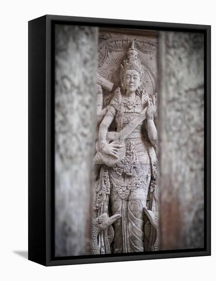 Temple carving, Ubud, Bali, Indonesia, Southeast Asia, Asia-Melissa Kuhnell-Framed Premier Image Canvas