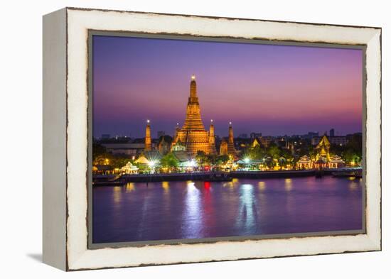 Temple of Dawn (Wat Arun) and Bangkok, Thailand-Jon Arnold-Framed Premier Image Canvas