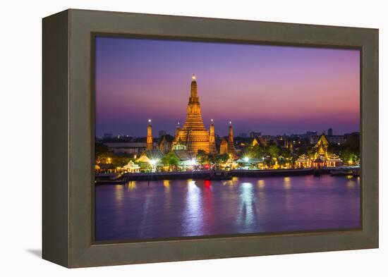 Temple of Dawn (Wat Arun) and Bangkok, Thailand-Jon Arnold-Framed Premier Image Canvas