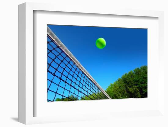 Tennis Ball on Net's Edge-mikdam-Framed Photographic Print