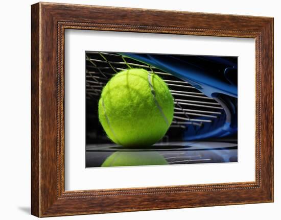 Tennis Racquet Resting on Top of a Tennis Ball-Flynt-Framed Photographic Print