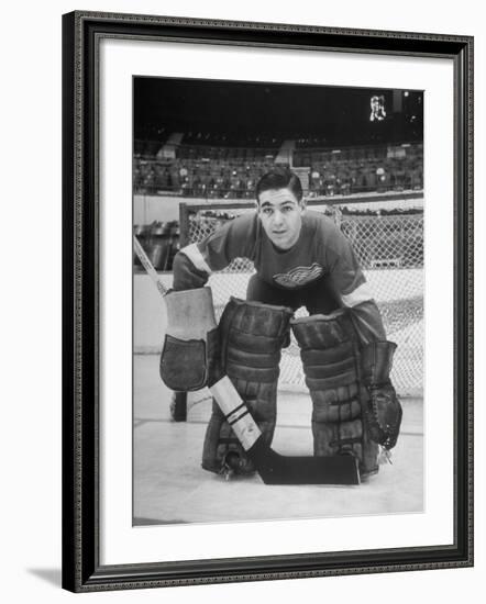 Terry Sawchuck, Star Goalie for the Detroit Red Wings, Posing in Front of Goal at Ice Arena-Alfred Eisenstaedt-Framed Premium Photographic Print