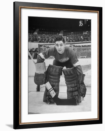 Terry Sawchuck, Star Goalie for the Detroit Red Wings, Posing in Front of Goal at Ice Arena-Alfred Eisenstaedt-Framed Premium Photographic Print