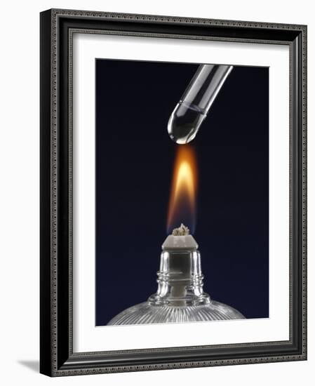 Test tube with liquid, over flame-null-Framed Photographic Print