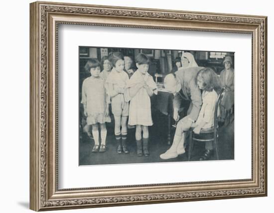 ' Testing the patella reflex for indication of nervous disease', c1935-Unknown-Framed Photographic Print