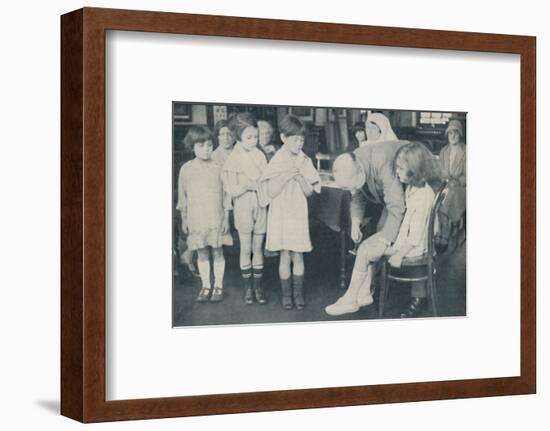 ' Testing the patella reflex for indication of nervous disease', c1935-Unknown-Framed Photographic Print