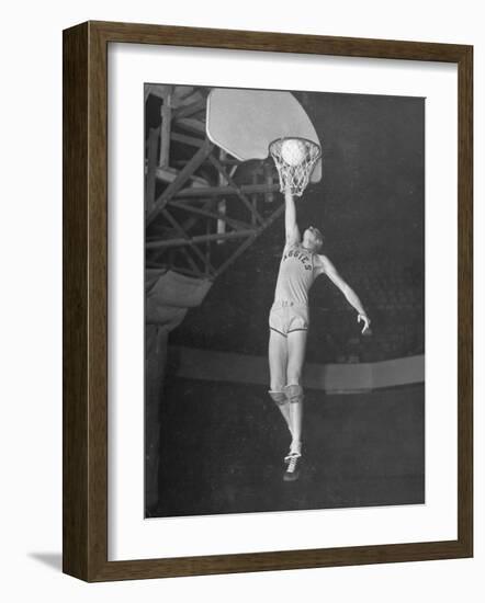 Texas A&M Basketball Player Bob Kurland Reaching to Make a Basket-Myron Davis-Framed Photographic Print