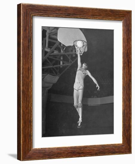 Texas A&M Basketball Player Bob Kurland Reaching to Make a Basket-Myron Davis-Framed Photographic Print